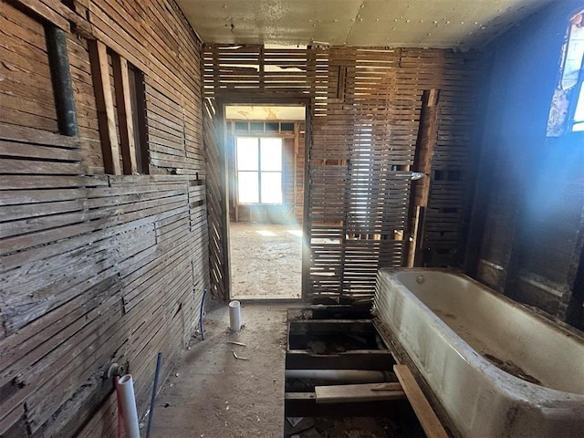 bathroom featuring a tub to relax in