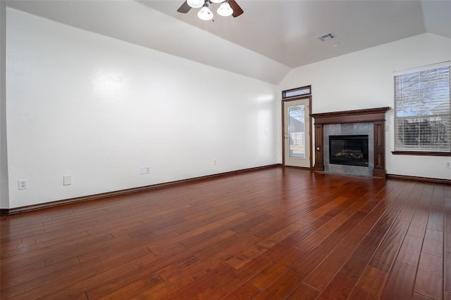 3520 SW 123rd Pl, Oklahoma City, OK 73170 - unfurnished living room with visible vents, vaulted ceiling, dark wood-type flooring, and a tile fireplace