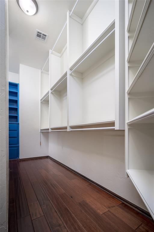 3520 SW 123rd Pl, Oklahoma City, OK 73170 - walk in closet with dark wood finished floors and visible vents