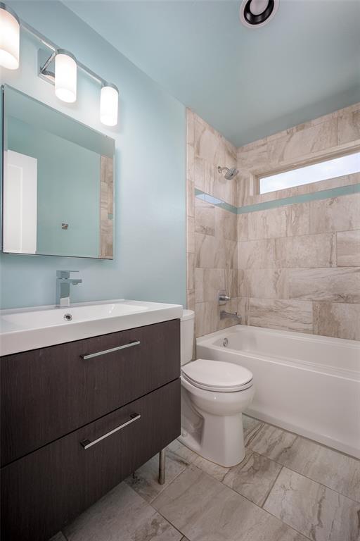 3520 SW 123rd Pl, Oklahoma City, OK 73170 - full bathroom featuring marble finish floor, bathing tub / shower combination, vanity, and toilet