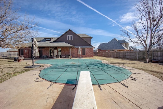 3520 SW 123rd Pl, Oklahoma City, OK 73170 - view of swimming pool with a patio area, a fenced backyard, and a fenced in pool
