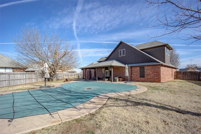 3520 SW 123rd Pl, Oklahoma City, OK 73170 - view of swimming pool featuring a fenced in pool, a patio area, a fenced backyard, and a lawn