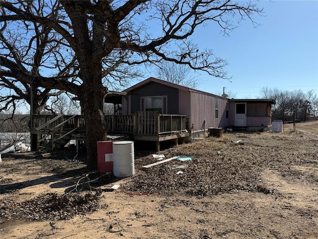 view of front of house with a wooden deck