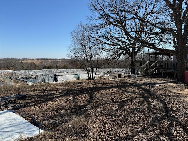 view of yard featuring a wooden deck