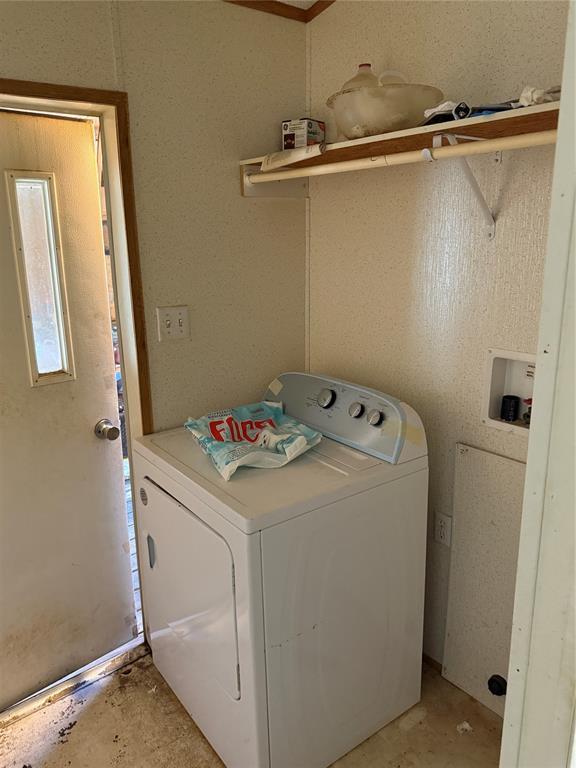 clothes washing area featuring washer hookup and laundry area