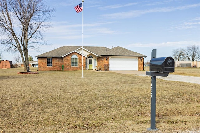 ranch-style home featuring a front yard, concrete driveway, brick siding, and an attached garage