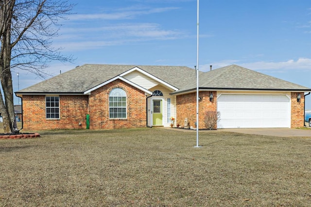 single story home with a garage, brick siding, a front lawn, and a shingled roof