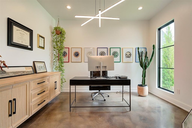 office area featuring concrete flooring, recessed lighting, and baseboards