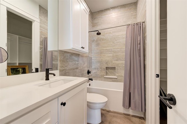 bathroom featuring toilet, shower / bath combination with curtain, vanity, and tile walls