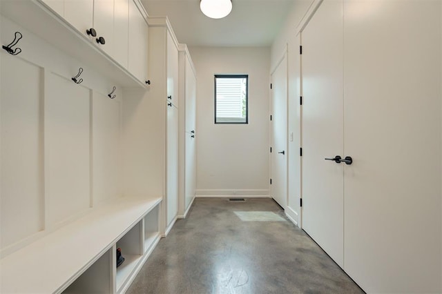 mudroom featuring finished concrete floors