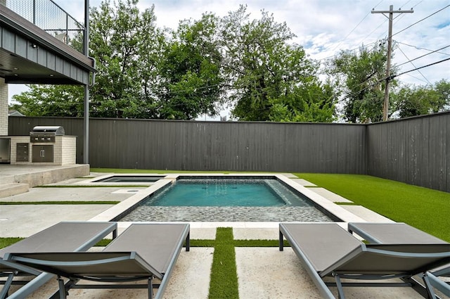 view of pool with a fenced in pool, a fenced backyard, a patio, and area for grilling