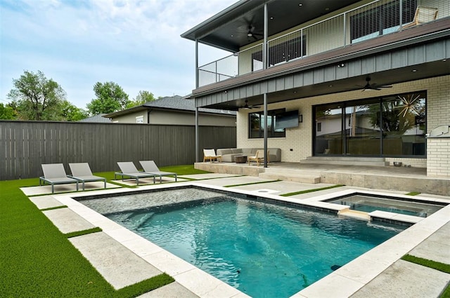 view of swimming pool with a ceiling fan, fence, an outdoor hangout area, and a patio