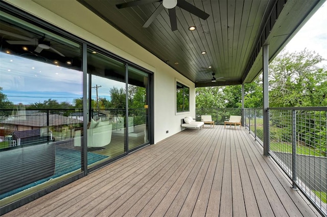 wooden terrace featuring ceiling fan