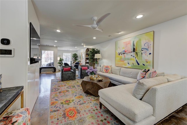 living area with ceiling fan and recessed lighting