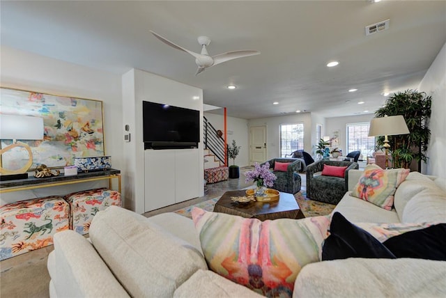 living room with stairs, visible vents, a ceiling fan, and recessed lighting