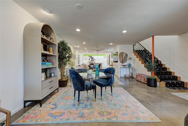 dining space with concrete flooring, ceiling fan, stairway, and recessed lighting