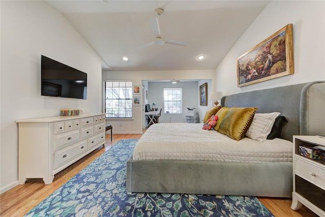 bedroom featuring lofted ceiling, light wood-type flooring, baseboards, and recessed lighting