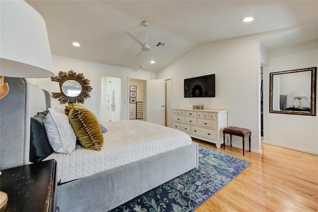 bedroom with light wood finished floors, baseboards, lofted ceiling, ceiling fan, and recessed lighting