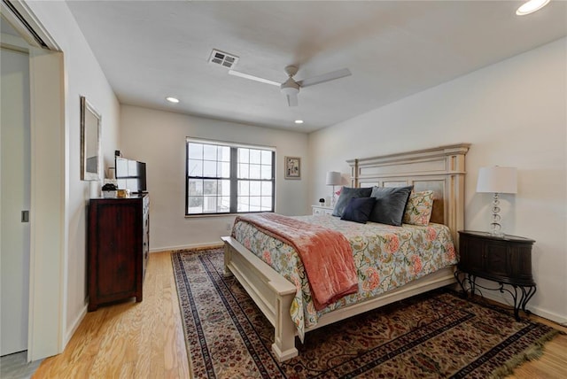 bedroom featuring recessed lighting, visible vents, baseboards, and wood finished floors