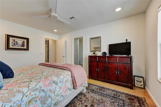 bedroom with baseboards, visible vents, a ceiling fan, wood finished floors, and recessed lighting