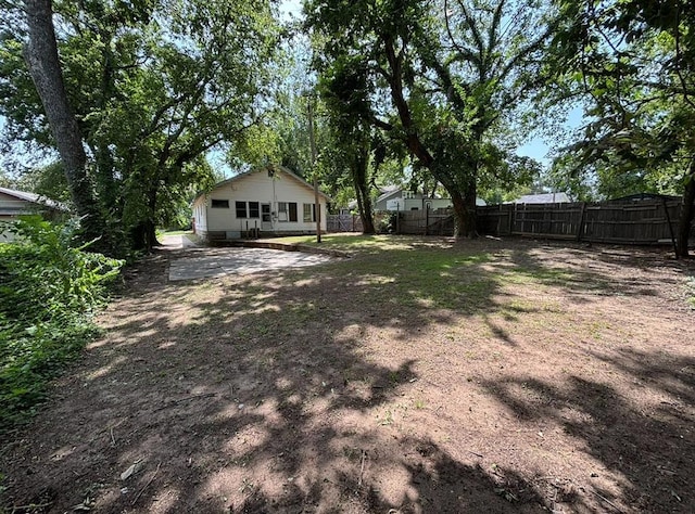 view of yard featuring a patio area and fence