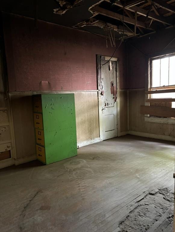 interior space with a garage and wooden walls