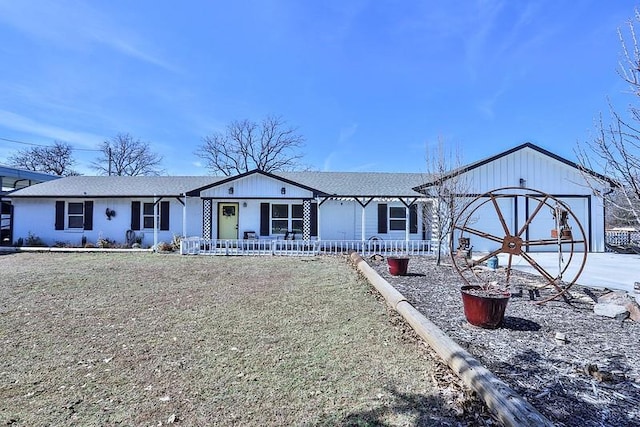 ranch-style home featuring covered porch and an attached garage