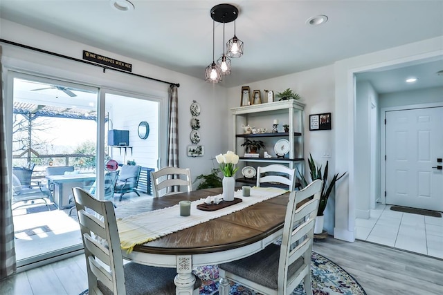 dining room featuring recessed lighting and light wood finished floors