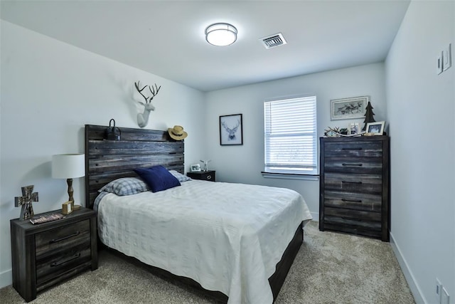 bedroom featuring carpet, visible vents, and baseboards