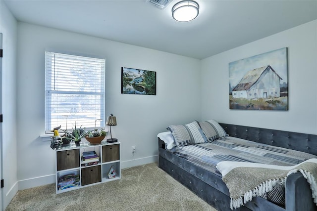 carpeted bedroom with visible vents and baseboards