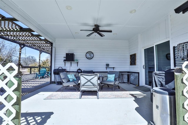 view of patio / terrace with an outdoor living space and a ceiling fan