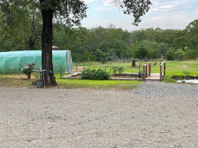 view of community featuring an outbuilding