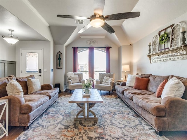 living room with vaulted ceiling, a ceiling fan, wood finished floors, and visible vents