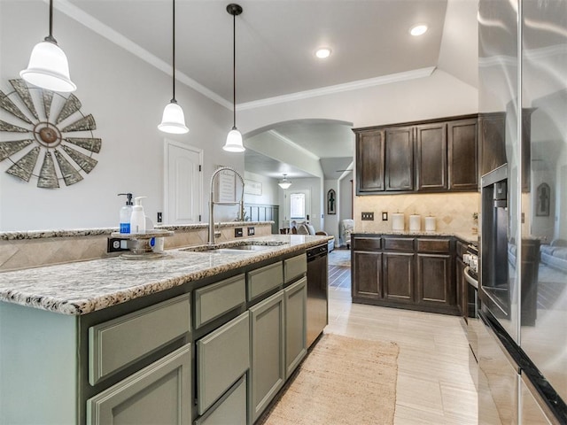 kitchen with dark brown cabinets, a sink, dishwasher, arched walkways, and ornamental molding