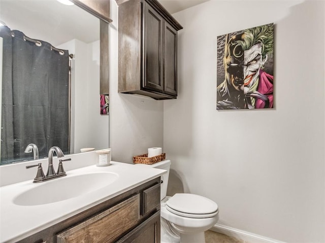 full bathroom with vanity, a shower with shower curtain, and toilet