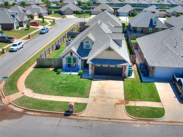 birds eye view of property with a residential view