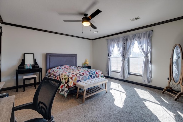 carpeted bedroom with baseboards, visible vents, ornamental molding, and a ceiling fan