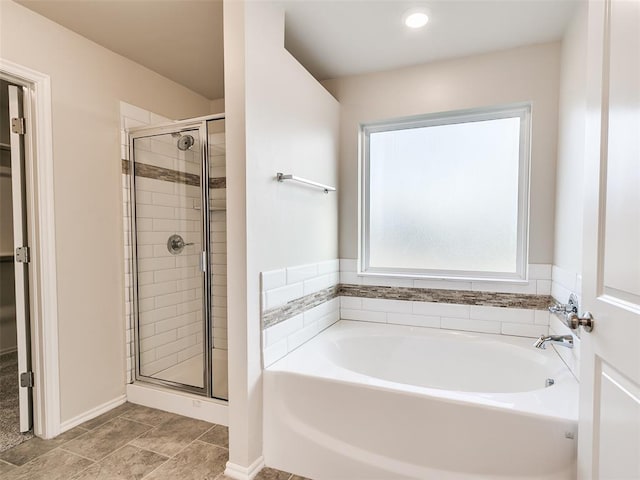 full bath featuring a shower stall and a bath