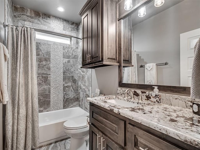 full bath featuring vanity, toilet, and shower / tub combo with curtain