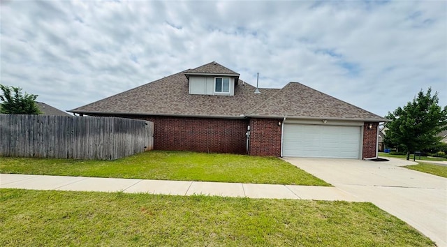 18816 Havenbrook Rd, Edmond, OK 73012 - view of side of home featuring an attached garage, concrete driveway, brick siding, and roof with shingles