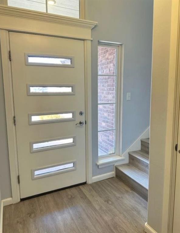 18816 Havenbrook Rd, Edmond, OK 73012 - entrance foyer featuring wood finished floors, baseboards, and stairs