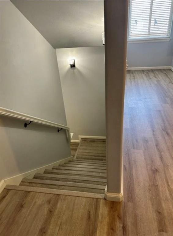 18816 Havenbrook Rd, Edmond, OK 73012 - stairway featuring baseboards and wood finished floors