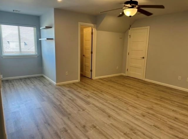 18816 Havenbrook Rd, Edmond, OK 73012 - unfurnished bedroom with wood finished floors, baseboards, and ceiling fan