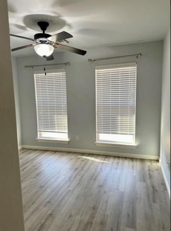 18816 Havenbrook Rd, Edmond, OK 73012 - spare room featuring baseboards, wood finished floors, and ceiling fan