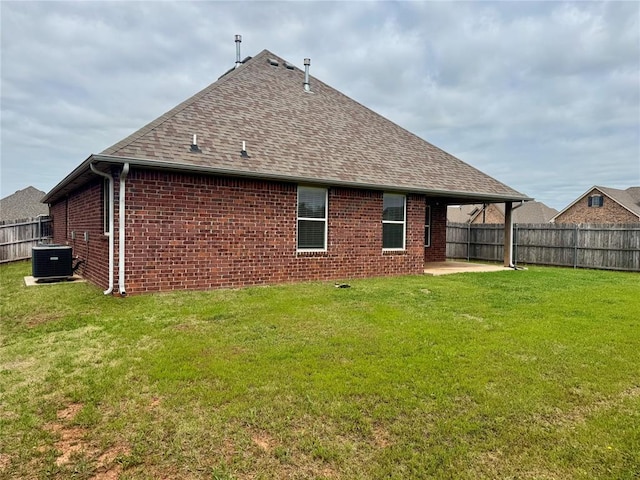 18816 Havenbrook Rd, Edmond, OK 73012 - rear view of house with roof with shingles, central AC, brick siding, and a patio area
