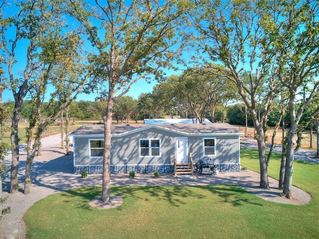 view of front of home with a front yard