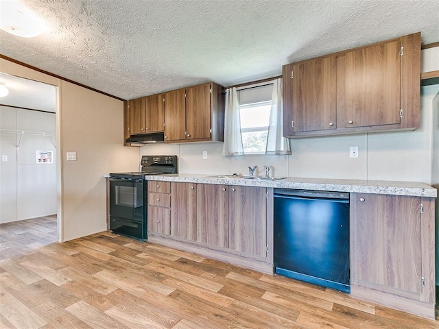 kitchen featuring light wood-style floors, dishwashing machine, black electric range oven, light countertops, and under cabinet range hood