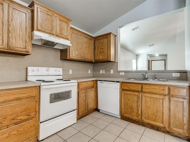 kitchen with vaulted ceiling, white appliances, a sink, and under cabinet range hood