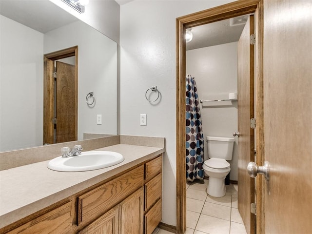 full bathroom featuring toilet, curtained shower, tile patterned flooring, and vanity