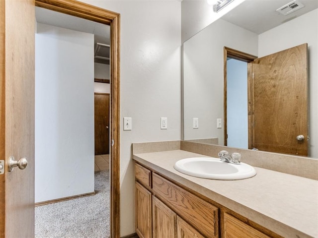 bathroom with visible vents and vanity